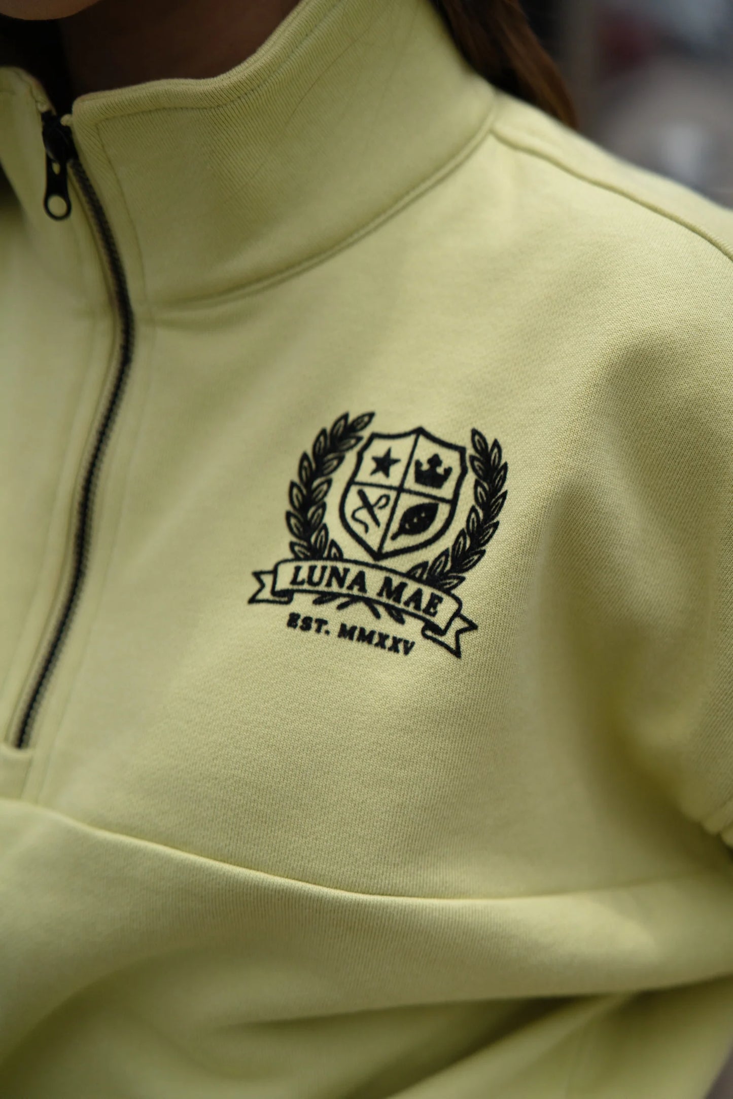 Yara half zip emblem lime sweatshirt FW26